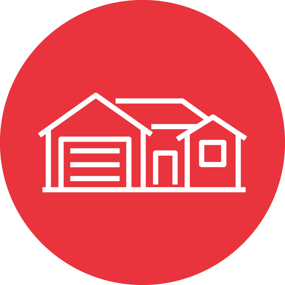 This is a simplified red circular icon featuring a white outline of two connected houses, one with a garage door, under a shared roofline.