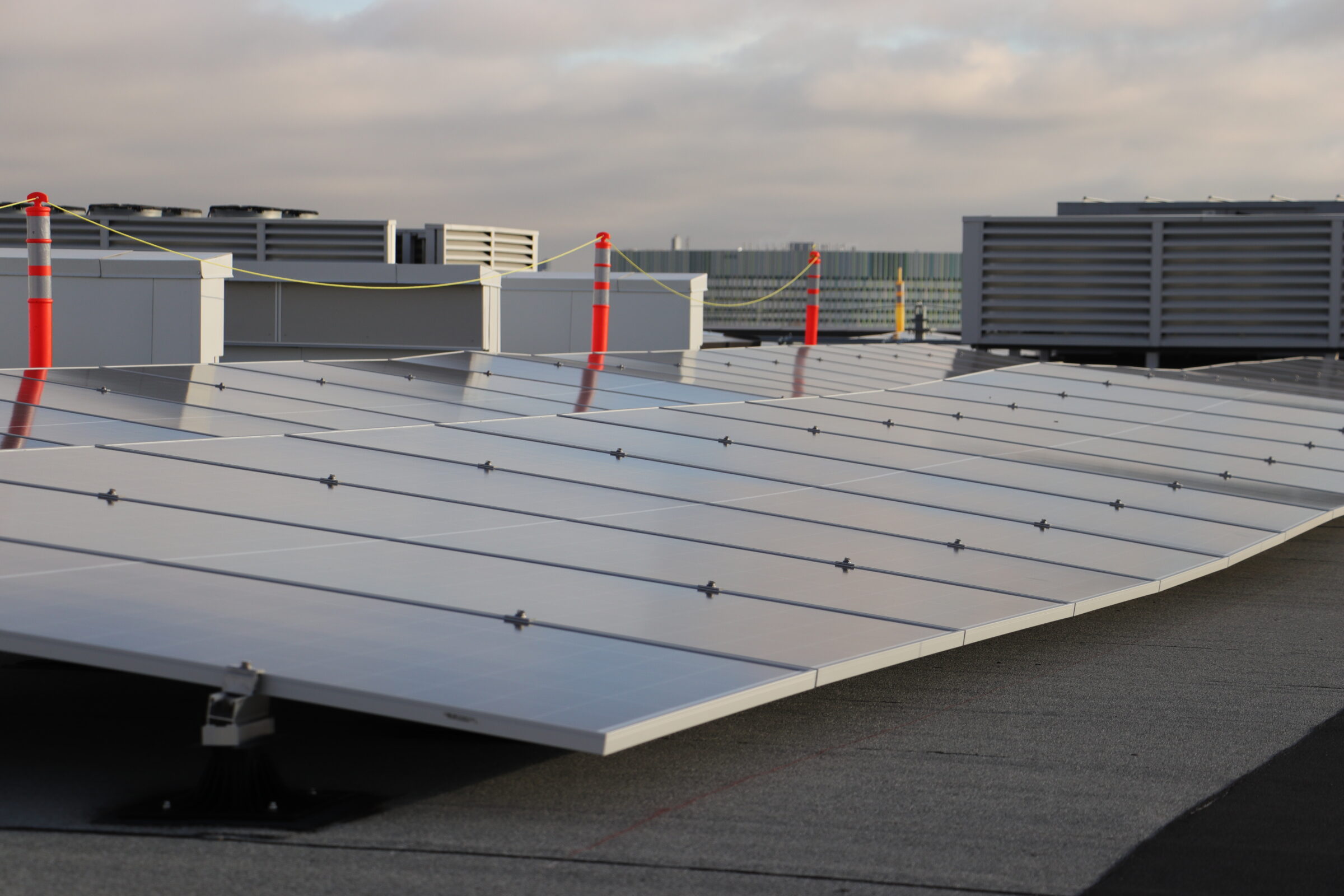 Commercial solar modules on a rooftop of a multi-use building.